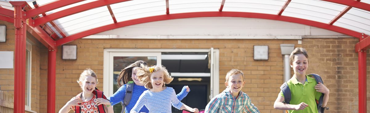 School Pupils Running in Playground