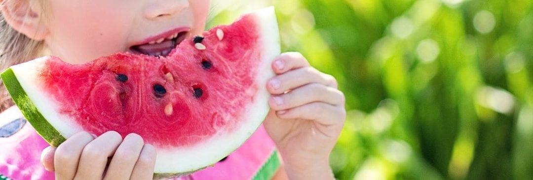 Young Girl Eating Watermelon